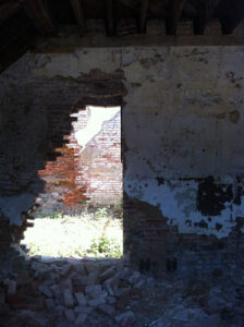 Image of hole in brick wall