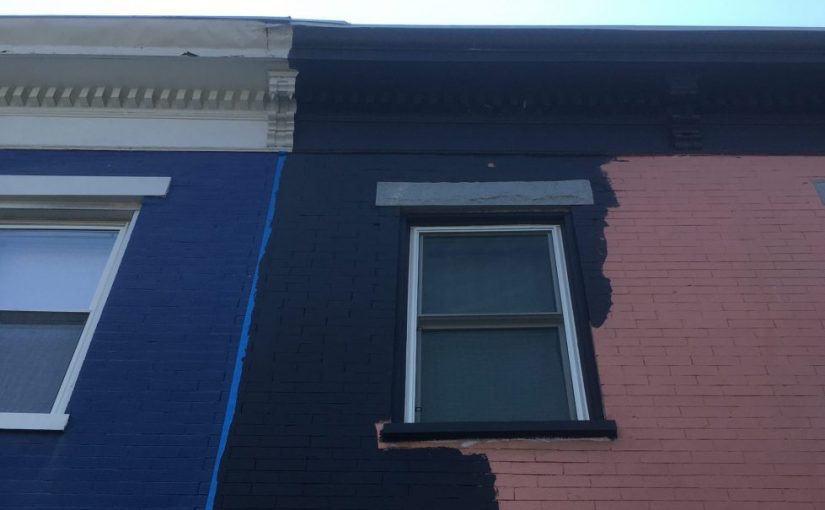 House being painted black